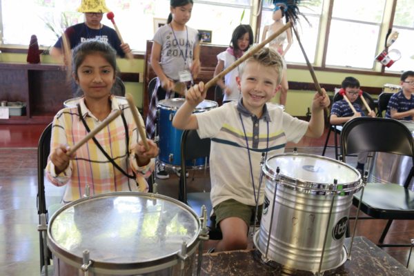 Junior CLARA summer campers playing instruments